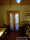 One of the 4 rooms of the big Villa (the one with staple beds up and down for 2 children)few meters from Valtos beach