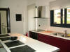 Separate luxurious kitchen/living room of Karamela Apartment