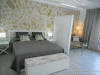 Bedroom with seperate open plan screen with the sofa norma lsize bed